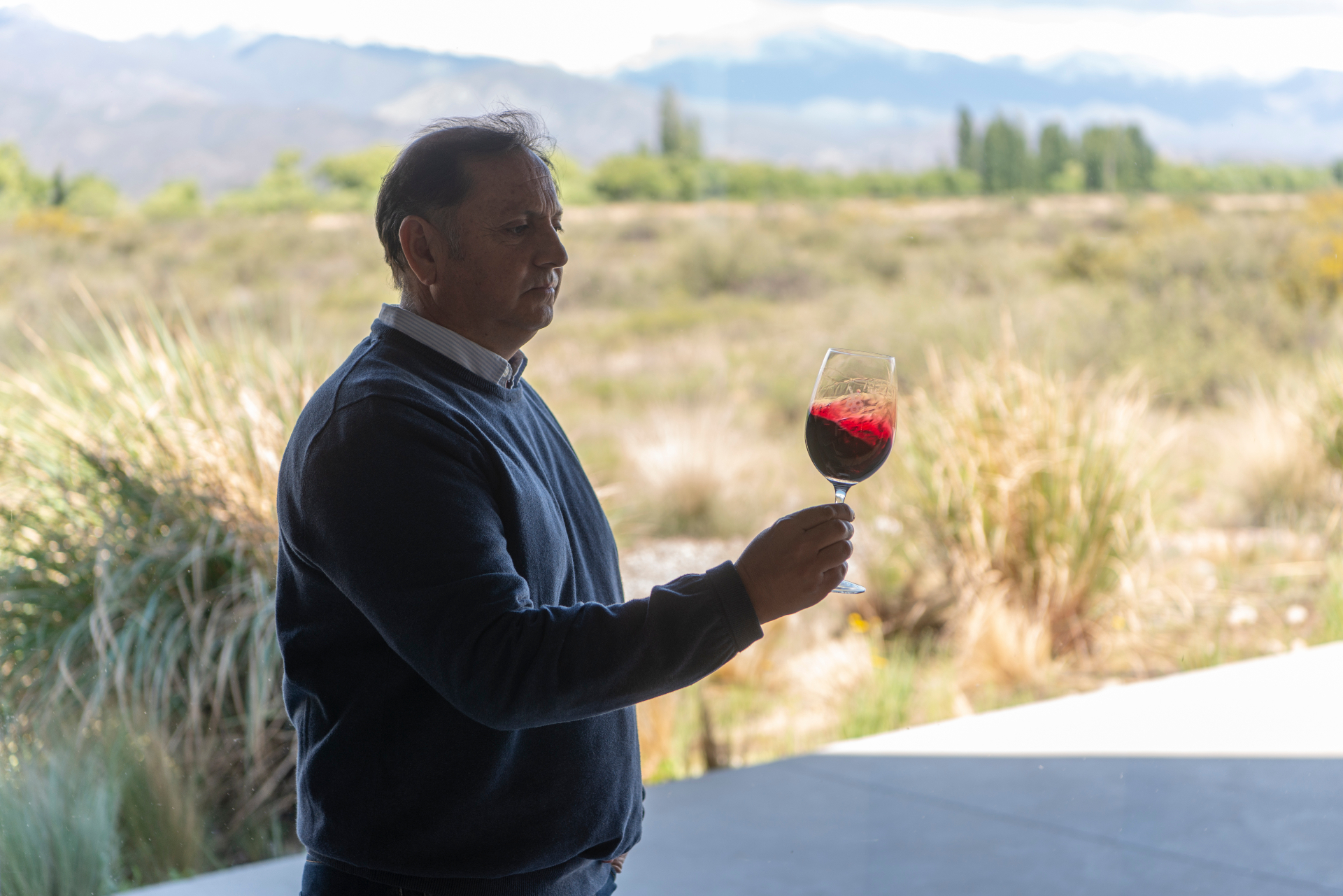 Winemaker in vineyard